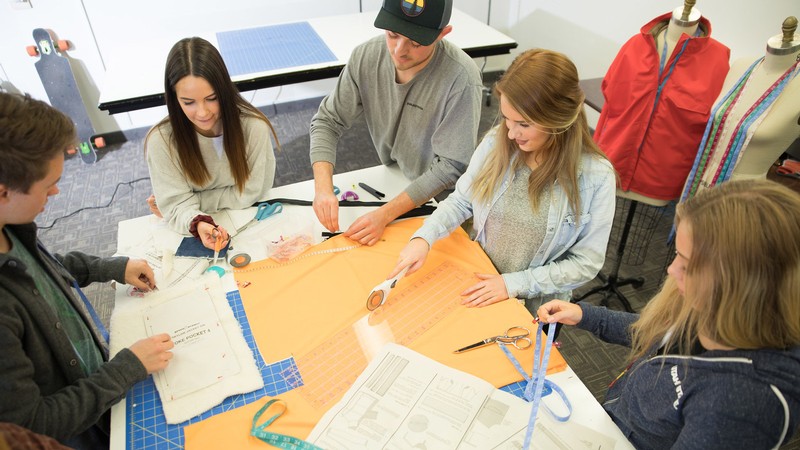 students gathered around a table