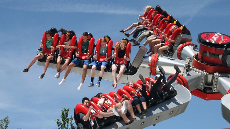Teens on amusement park ride.