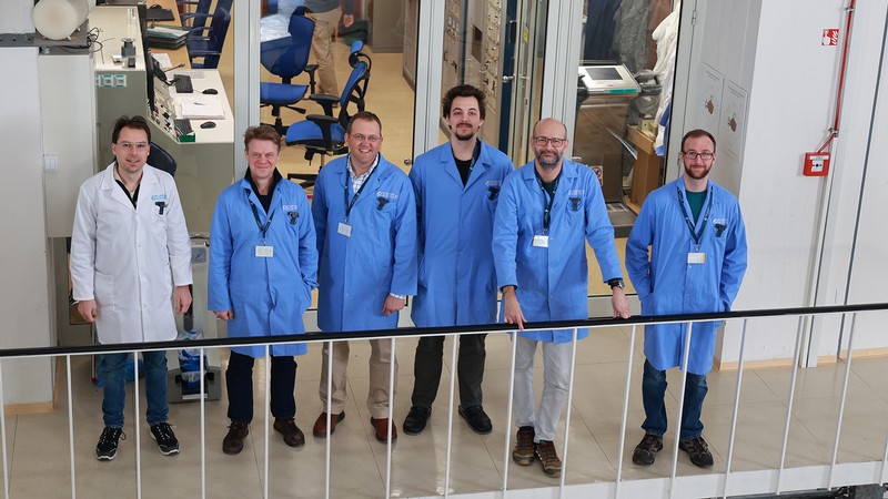 Scientists gather to pose for a photograph