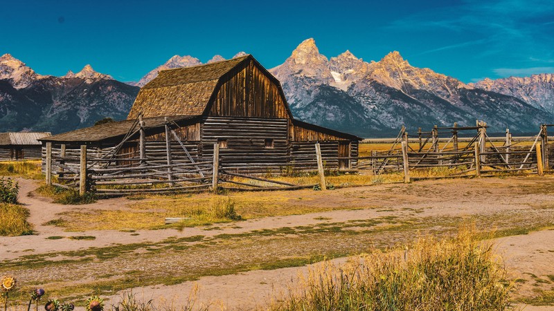 A barn in a mountain valley.