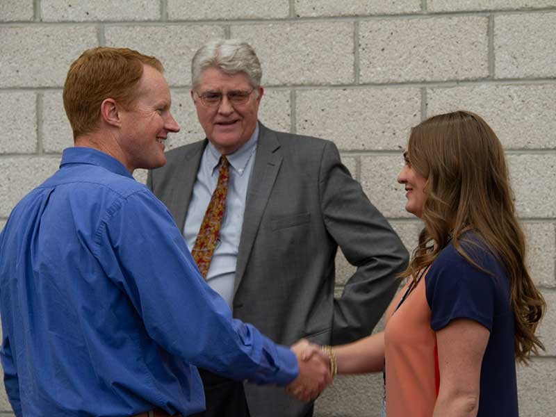 Regan Eggli with Jed Hancock and H. Scott Hinton