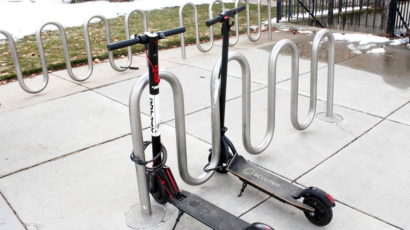 Electric scooters are pictured parked on campus.