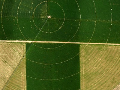 an aerial view of an irrigated field caption by AggieAir