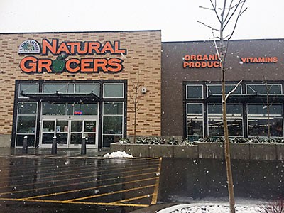 the front and parking area of Logan's Natural Grocers store