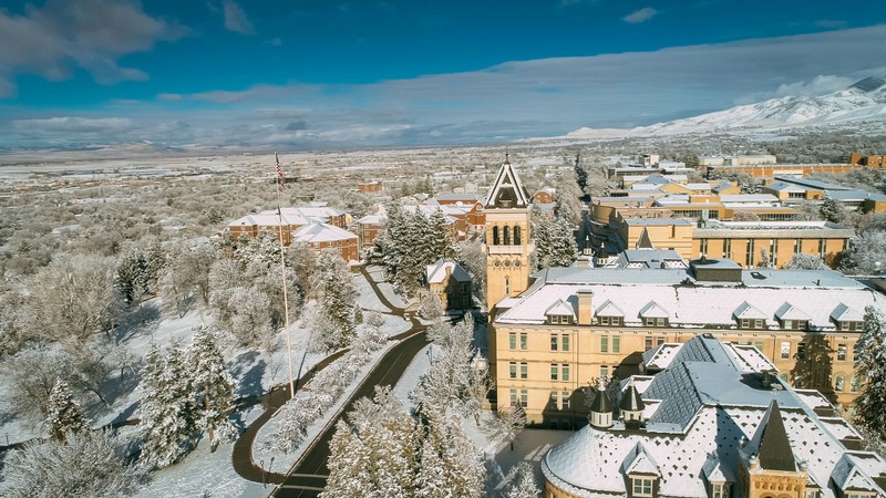 Old Main and the Logan campus covered in snow.