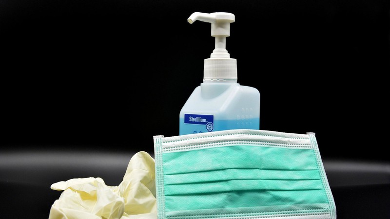 hand sanitizer, gloves and a face mask.