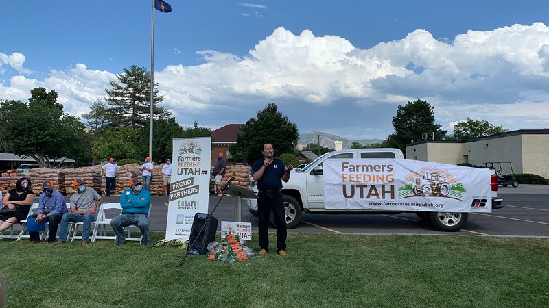 Dean Ken White addresses the public at a Farmers Feeding Utah Miracle project.