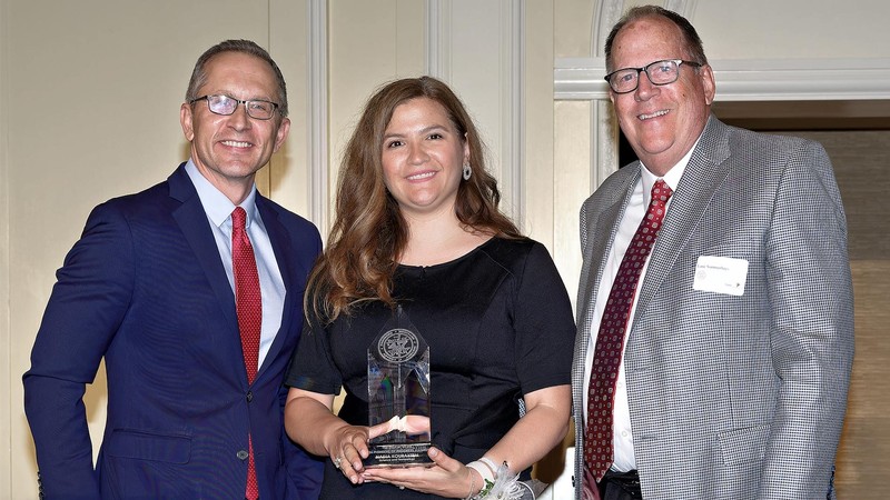 USU Professor Nadia Kouraytem (middle) holding award for her work in the advanced manufacturing.