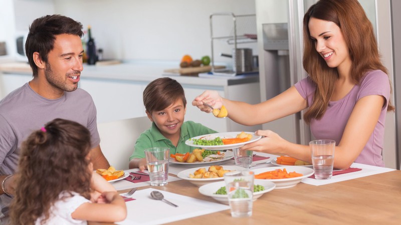 A family at the dinner table.
