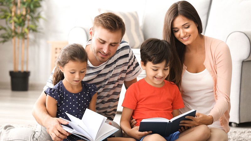 mom and dad reading to children.