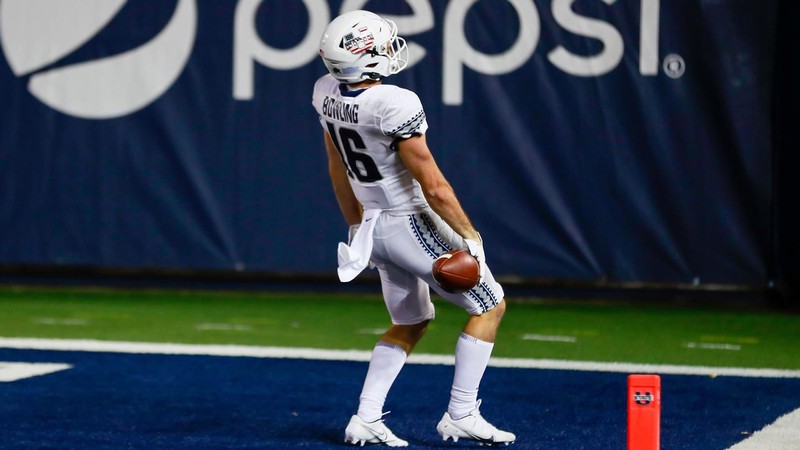 USU football player celebrates on the field.