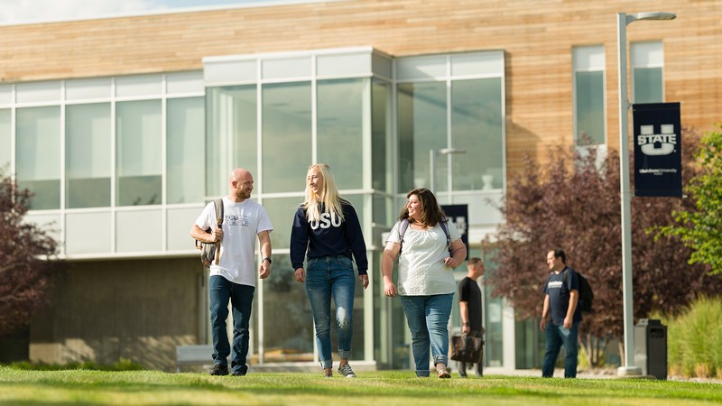 USU students walk on campus.