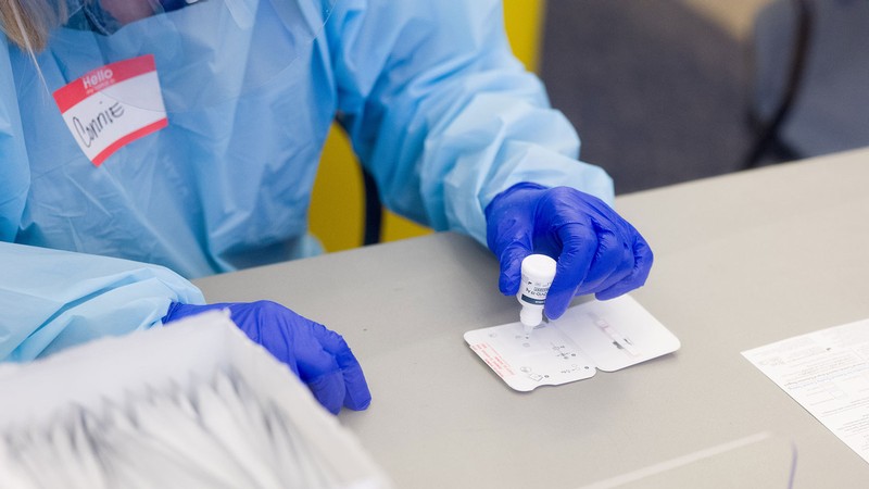 Lab employee conducting a COVID-19 test.