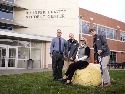 Four people pose for a photo