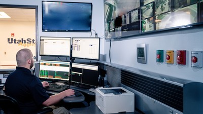 A person in a surveillance room.