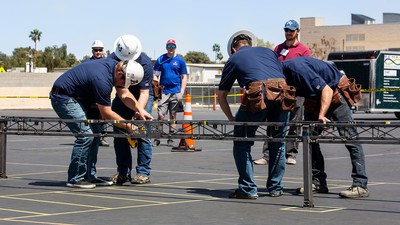 Engineering students build a model bridge.