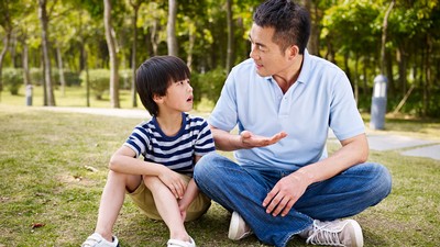 A father talks to a son.