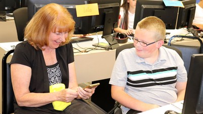 Vicki Allan speaks with a student.