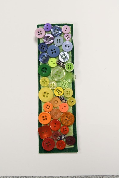 A work of art featuring multicolored buttons.