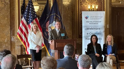 Brian Higginbotham and Melissa Ballard speaking in the Utah Capitol Building.