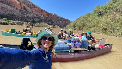 Students in canoes on a river.