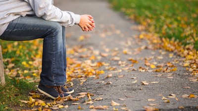 A person holding their hands in thought.