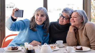 A group of older women taking a selfie.