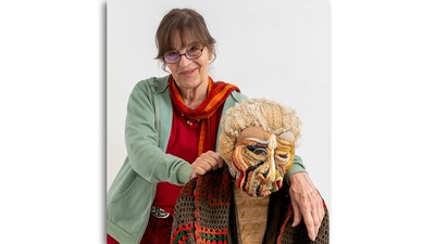 Jann Haworth posing with her sculpture titled "Old Lady,"