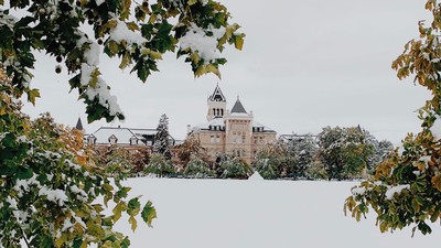 Old Main in winter snow.