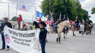 Horseback riders in a parade.