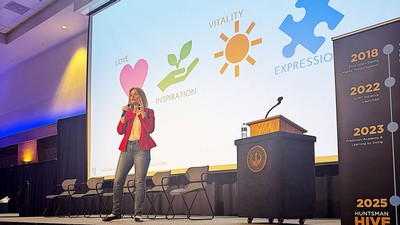 Erin Clark speaking on a stage.