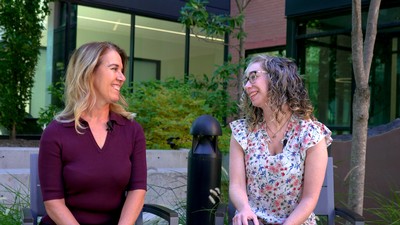Tressa Johnston and Cari Gongora speaking outdoors.