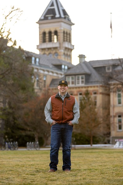 Wyatt Nebeker standing in front of Old Main.