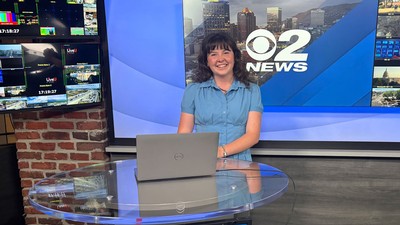 News intern Hannah Webb at an anchor desk.