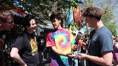 Four young people at an amusement park.