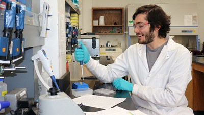 Daniel Emanuel at a lab bench.