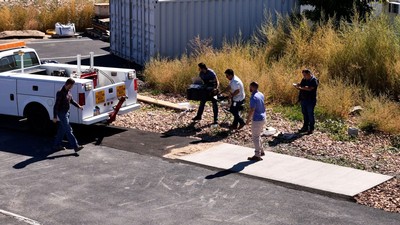 Researchers working with engineering equipment.