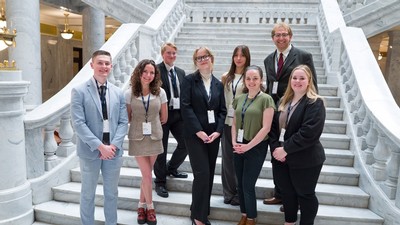 Students standing on a staircase in the Utah Capitol.