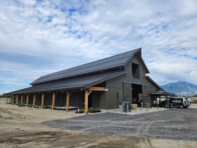 The exterior of a large barn.