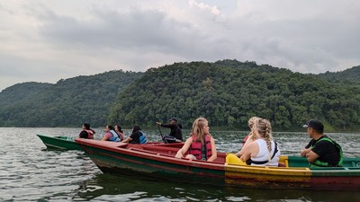 People riding in boats.