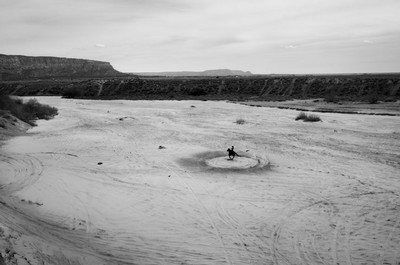 A black and white photo of a desert landscape.
