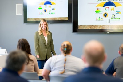 Amanda Deliman teaching in a classroom.