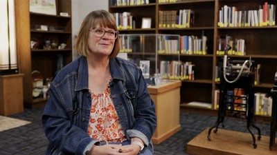 Aimee Lauritsen in a library.