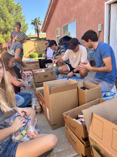 People putting together hygiene kits for a service project.