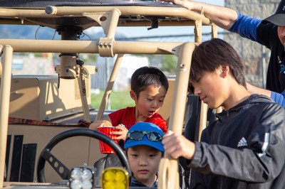 Kids inside an electric vehicle.
