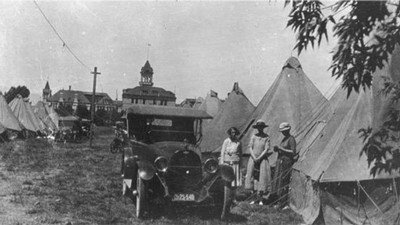 women gathered in historic image of the Farmer's Encampment.