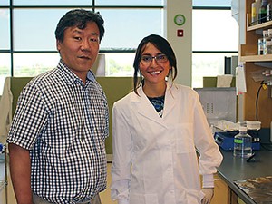 USU faculty member Yong-Min Lee and Weber State student Jackie Bedoya-Wilkinson in a USU laboratory