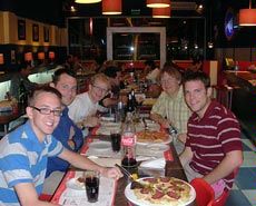 USU students sampling pizza in Argentina