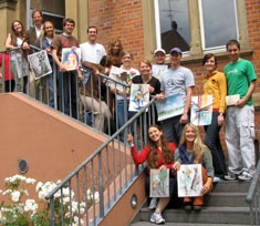USU students on guesthouse steps