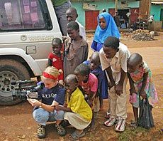 USU student Ashley Karras with children in Uganda
